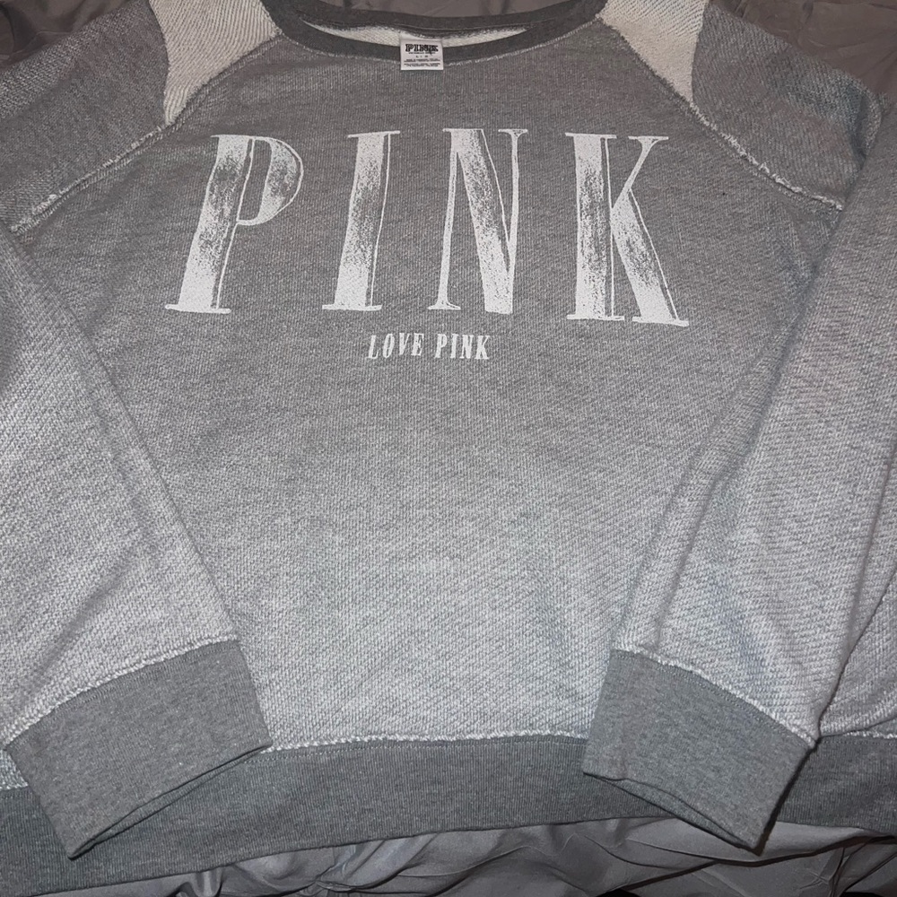 Pink by Victoria’s Secret grey and white sweatshirt.